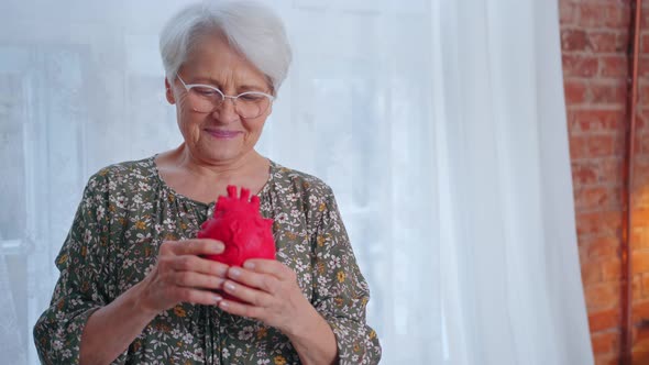 Caucasian Grandmother Reminding About Examining Heart Diseases and Taking Care of Health