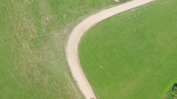 the tractor curves on a dirt road