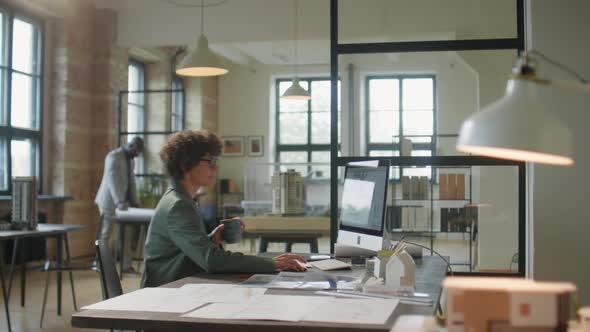 Female Architect Working in Office