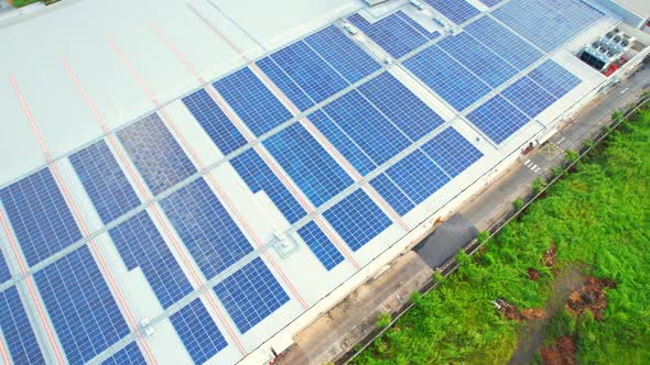 Aerial cinematic view of a solar panel on mall roof top