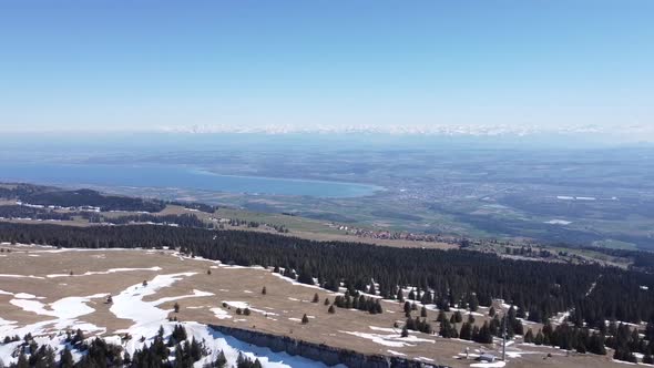 drone flight over the famous sealand in switzerland, with perfect weather and the swiss alps in the