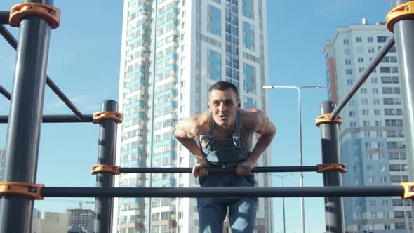 A man exercising on a sports ground