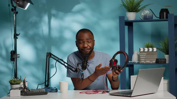 POV of Influencer Reviewing Headphones on Camera for Vlog