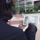 African American Man Works with Tablet Computer Urban Park Flips Through Feed on Social Networks - VideoHive Item for Sale