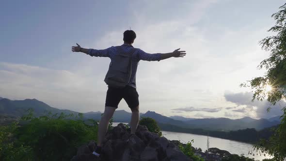 Young Man Freedom On The Top Of Mountain