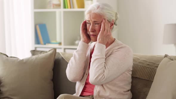 Senior Woman Suffering From Headache