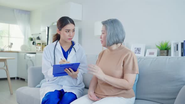 Asian caregiver psychology doctor examine and listen to woman patient