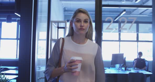 Businesswoman walking in modern office