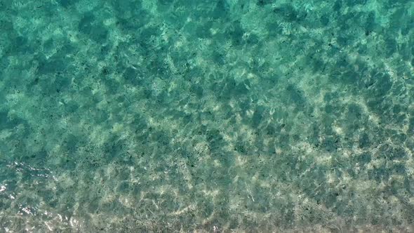 Water Texture on Sandy Beach