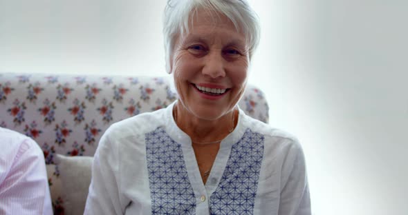 Front view of active Caucasian senior woman sitting in the nursing home 4k