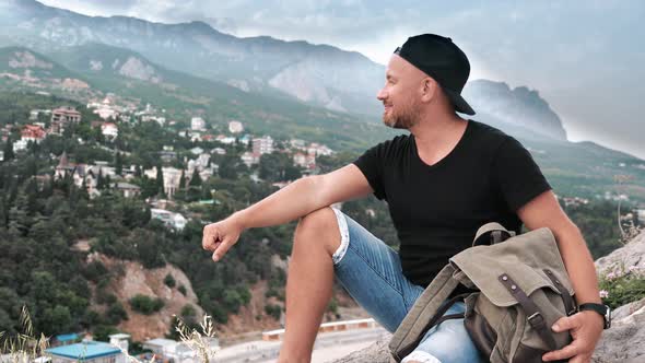 Happy Hipster Bearded Guy Smiling Contemplating Nature Scenery Countryside at Valley Top Mountain