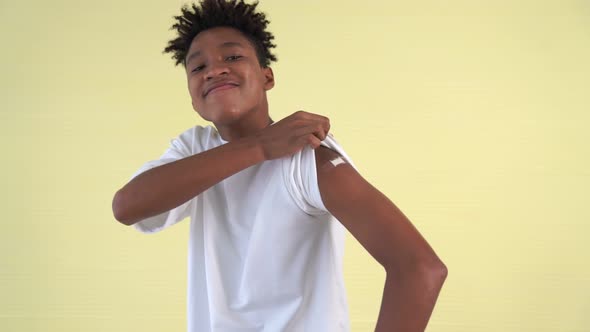 African American Teenager Showing COVID19 Vaccine Bandage Merrily