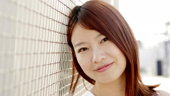 Happy Young Asian Female Person Smilling at Camera