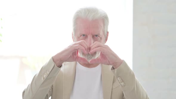 Old Man Showing Heart Shape By Hands