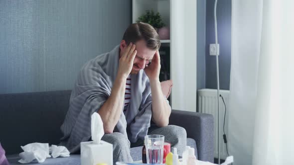 Sick Man Is Suffering From Severe Headache Touching His Head Massaging Temples Indoors at Home.