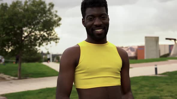 Happy african gay man with make up sending kisses on camera