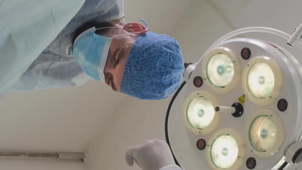 Doctors Conducting Surgery at Hospital