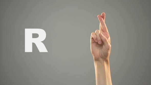 Letter R in Sign Language, Hand on Background, Communication for Deaf, Lesson