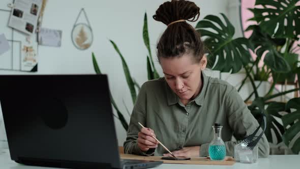 Woman Fixes Glass Plates