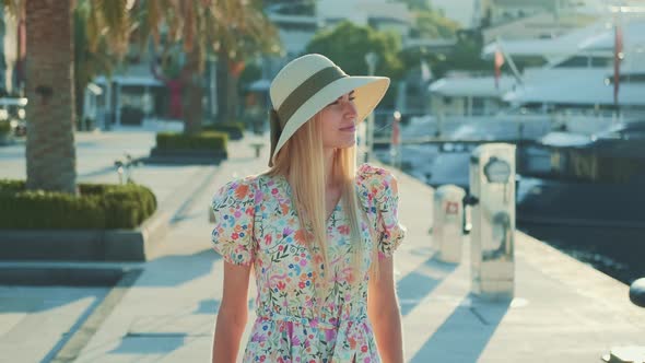 Caucasian Woman in Sun Hat Thinking About Something