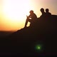 Silhouette group of people admiring the sunset on top of mountain - VideoHive Item for Sale