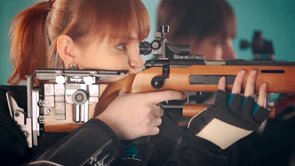 Women Shooting with Rifle