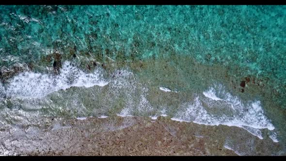 Aerial view landscape of relaxing coastline beach time by turquoise lagoon and clean sandy backgroun