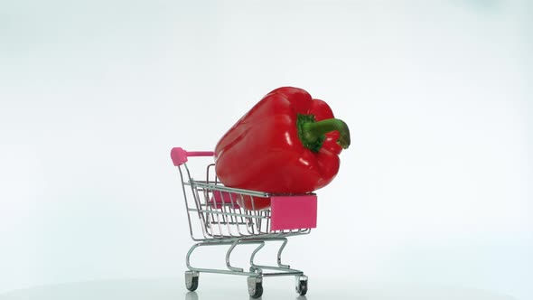 Vegetable Bell Pepper In A Trolley From A Supermarket Is Spinning On A Revolving Table,  Red Pepper