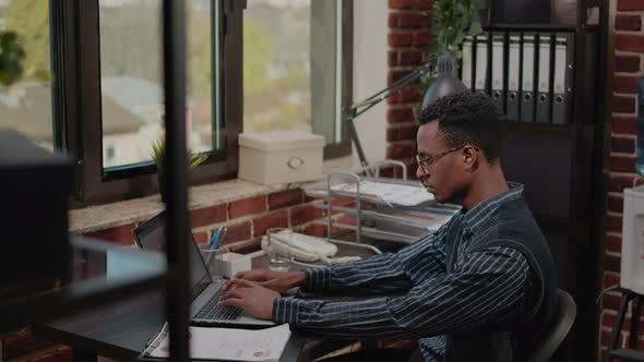 Business Man Working on Commercial Report in Startup Office