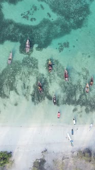 Vertical Video Boats in the Ocean Near the Coast of Zanzibar Tanzania