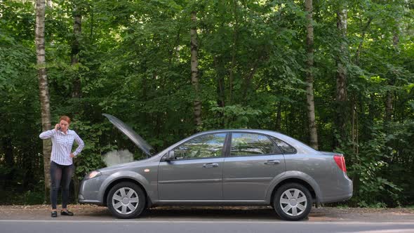 A Young Woman Calls the Evacuation Service Because Her Car Is Broken