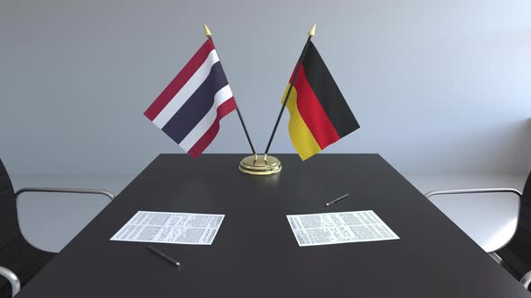 Flags of Thailand and Germany on the Table