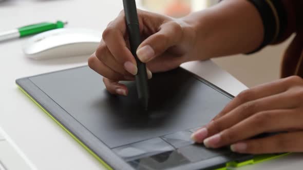 Young woman working in a creative office