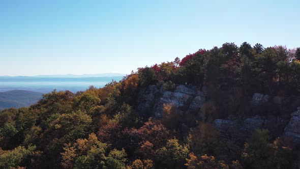 Man stands on Tibbet Knob - West Virginia - Aerial - Autumn