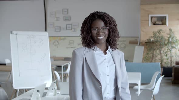 Cheerful African American Businesswoman Smiling at Camera