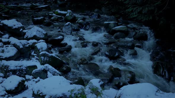 Snowy Mountain River In The Evening