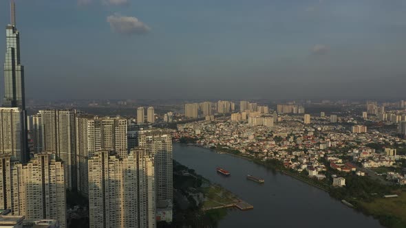 Late afternoon view of high-rise development and skyscraper from drone with view to city skyline and