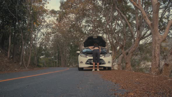 Woman Having Car Troubles on the Road