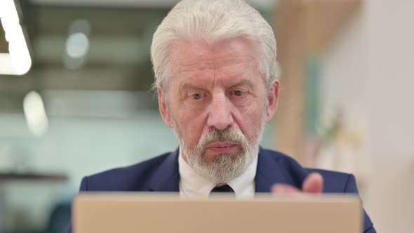 Close Up of Senior Old Businessman Doing Video Chat on Laptop 