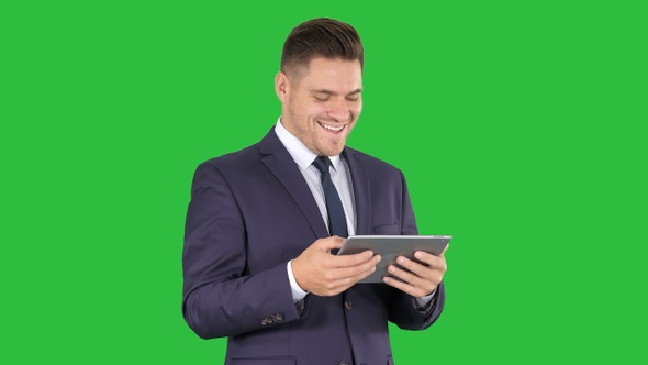 Businessman Reading or Working on A Digital Tablet