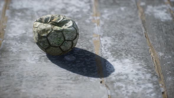 Old Soccer Ball the Cement Floor alt