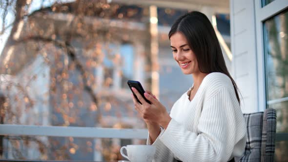 Woman Chatting Use Smartphone at Terrace of Countryside House