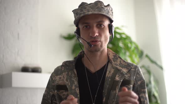 Portrait of a Man in Military Fatigues Face to Camera