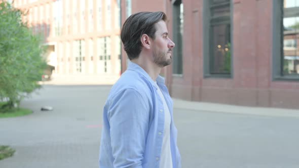 Attractive Man Walking in Street Side Pose