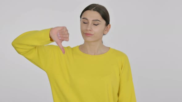 Spanish Woman showing Thumbs Down on White Background