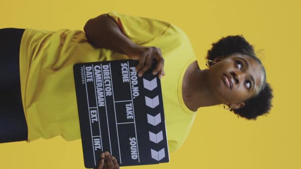 Bored Woman Clapping Clapperboard