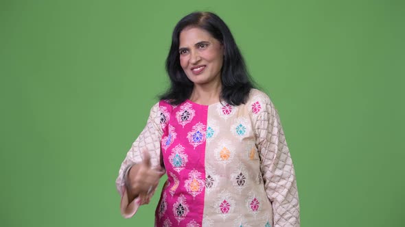 Mature Beautiful Indian Woman Giving Thumbs Up