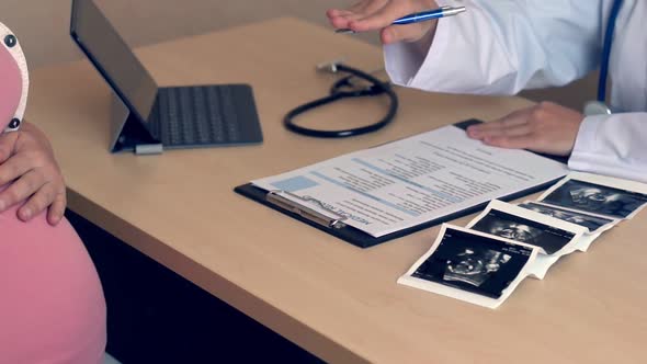 Pregnant Woman and Gynecologist Doctor at Hospital