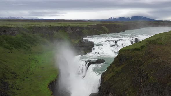 Gullfoss waterfalls in Iceland with drone video low and moving up.