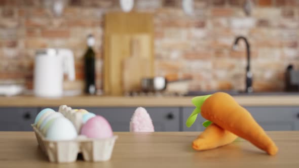 Video of playful girl taking a carrot from the table.  Shot with RED helium camera in 8K.